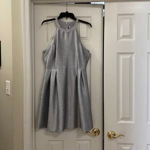 Jennifer Lopez cocktail dress. New with tags. Beautiful silver beaded neckline.